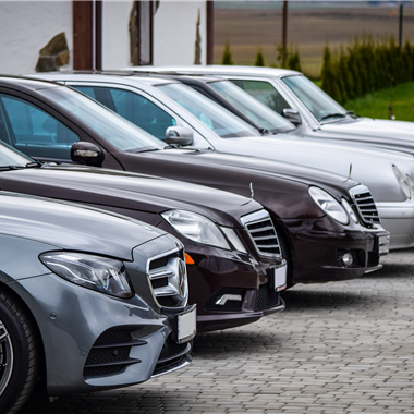 Luxury cars all parked in a row